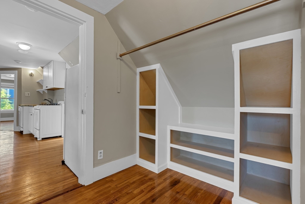 28 Evergreen Street, Unit 3 Boston, MA 02130 - Photo 9 of 16 a view of an entryway with wooden floor and a kitchen