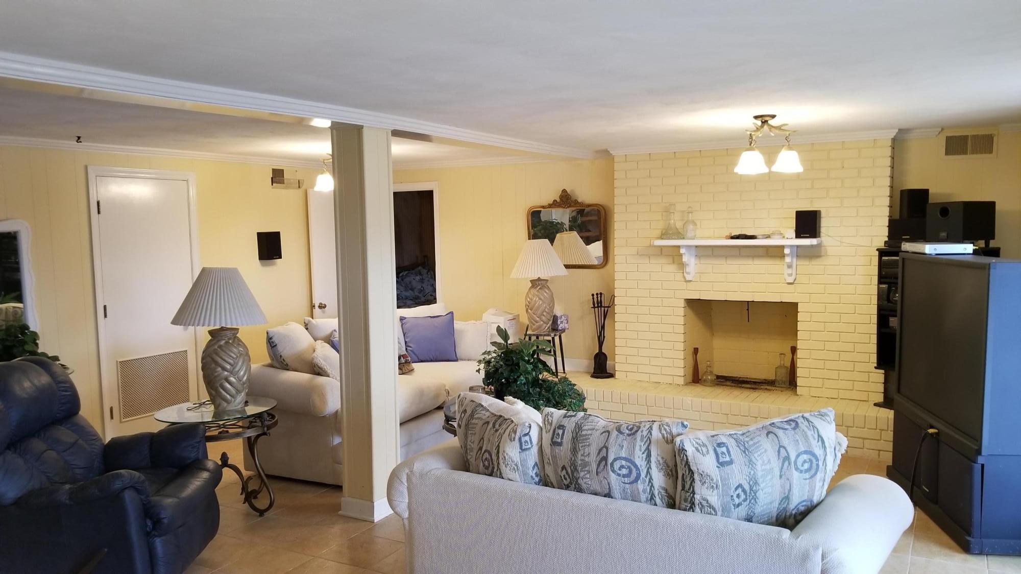 541 Highland Lake Road Union Hall, VA 24176 - Photo 3 of 37 a living room with furniture and a fireplace