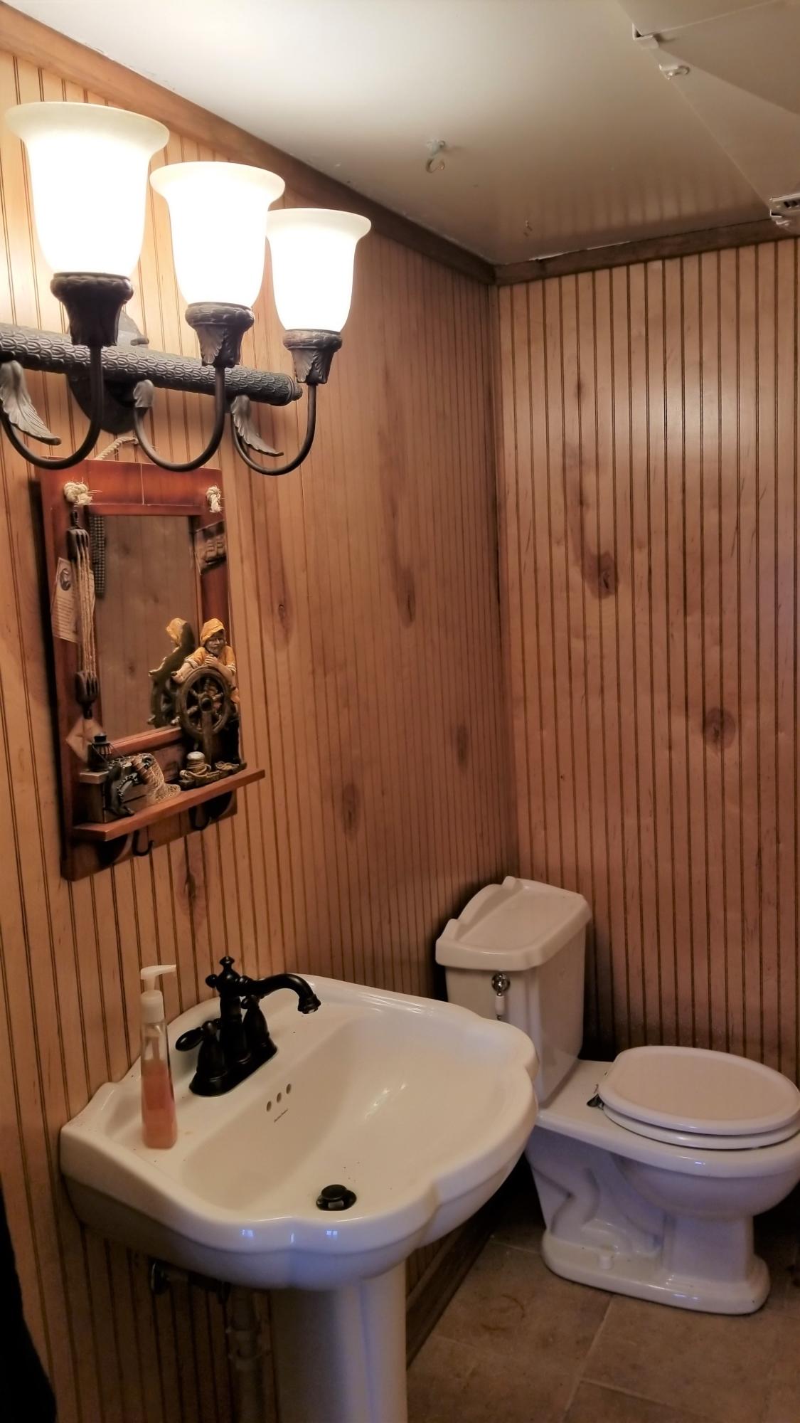 541 Highland Lake Road Union Hall, VA 24176 - Photo 20 of 37 a bathroom with a sink and a mirror