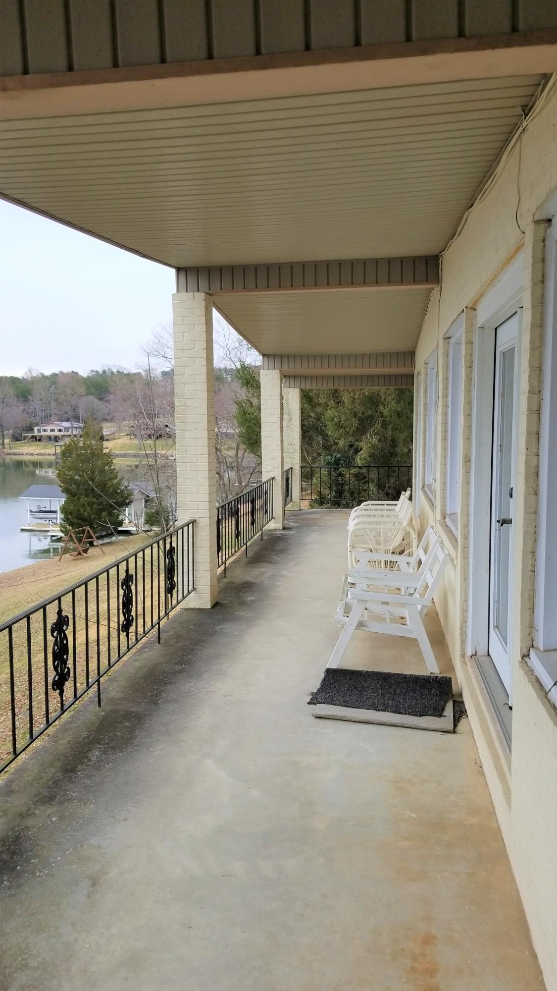 541 Highland Lake Road Union Hall, VA 24176 - Photo 24 of 37 a view of a patio with a table and chairs