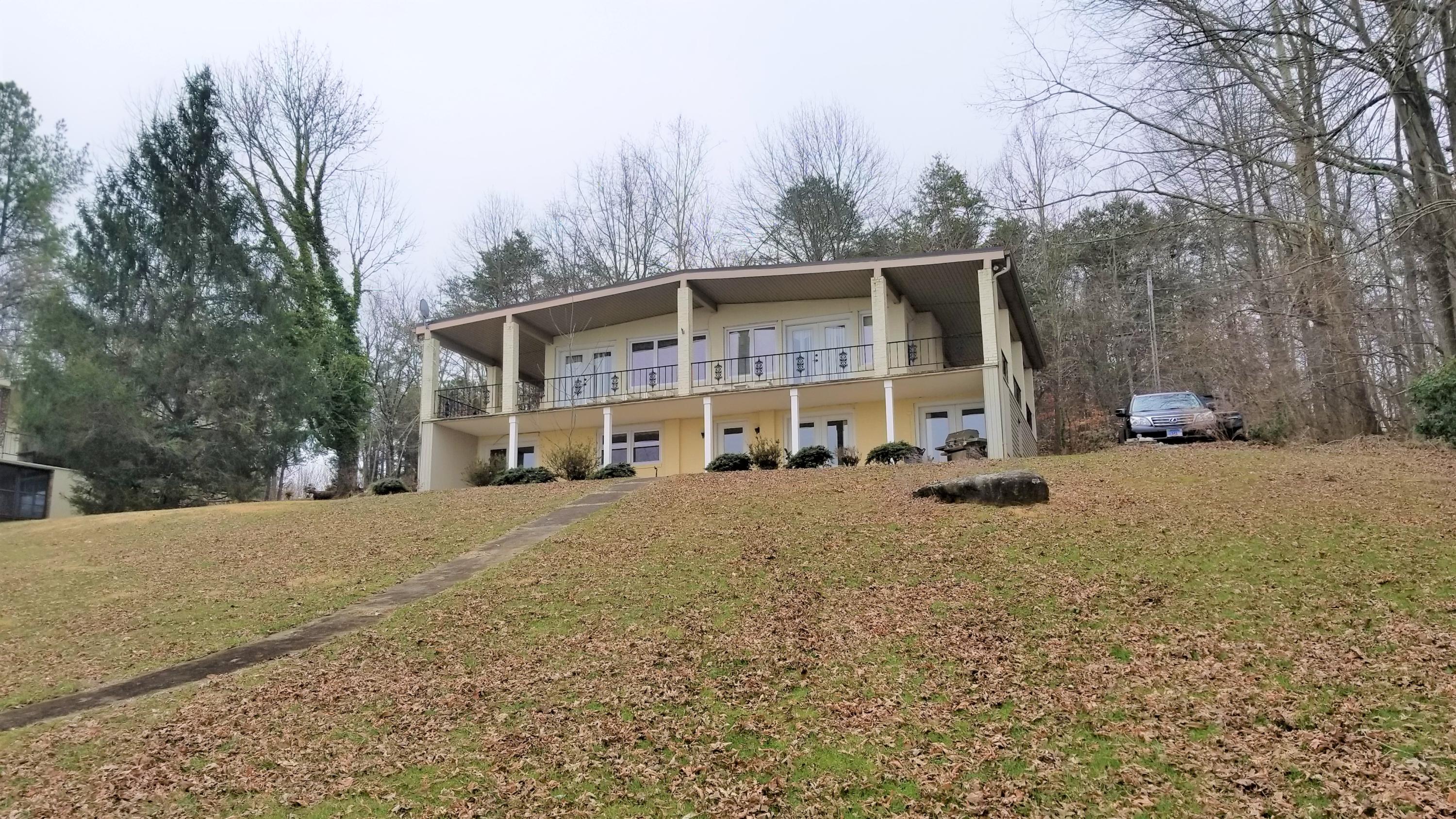 541 Highland Lake Road Union Hall, VA 24176 - Photo 26 of 37 a view of a house with a yard covered in snow