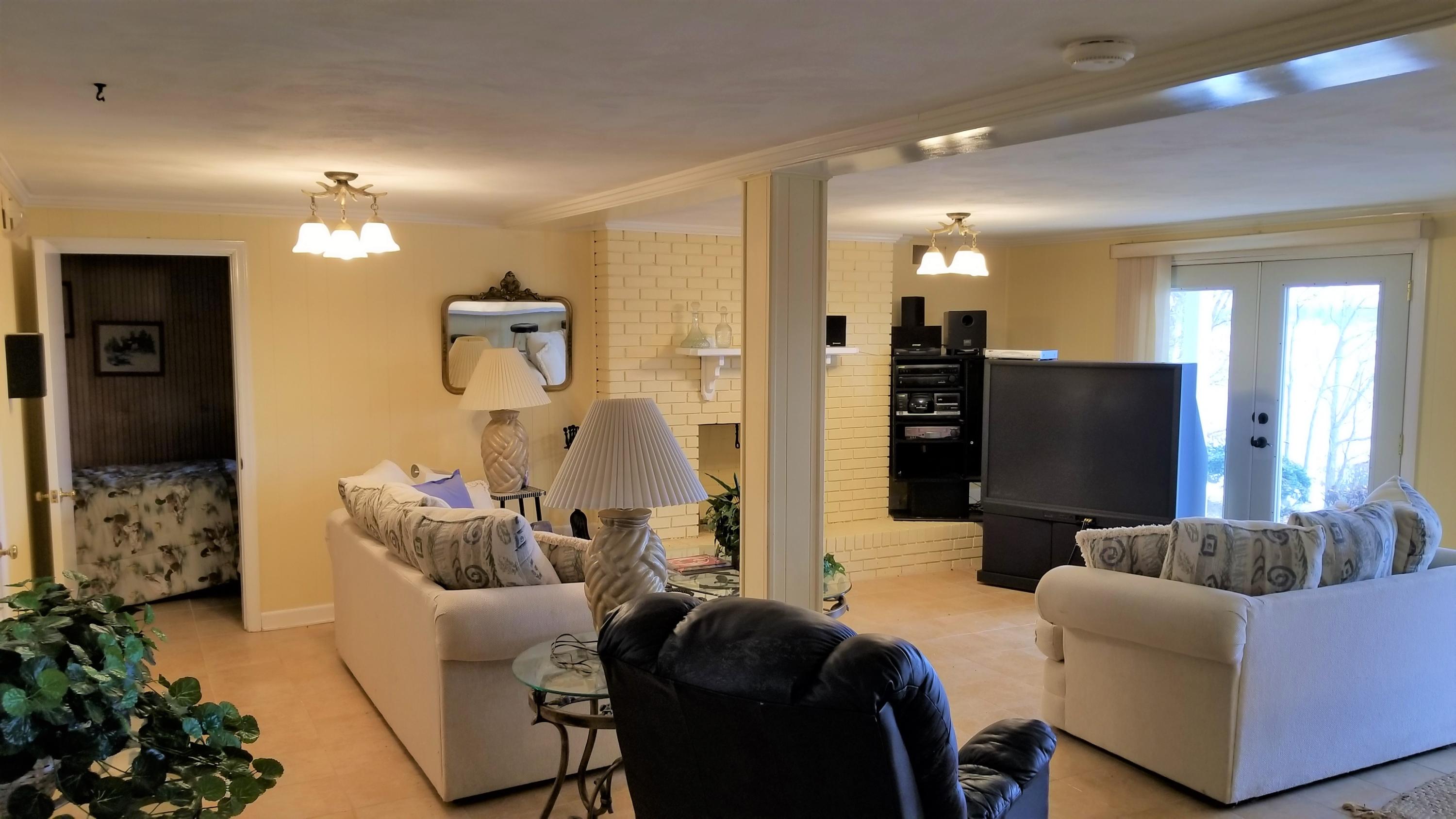 541 Highland Lake Road Union Hall, VA 24176 - Photo 4 of 37 a living room with furniture and a flat screen tv