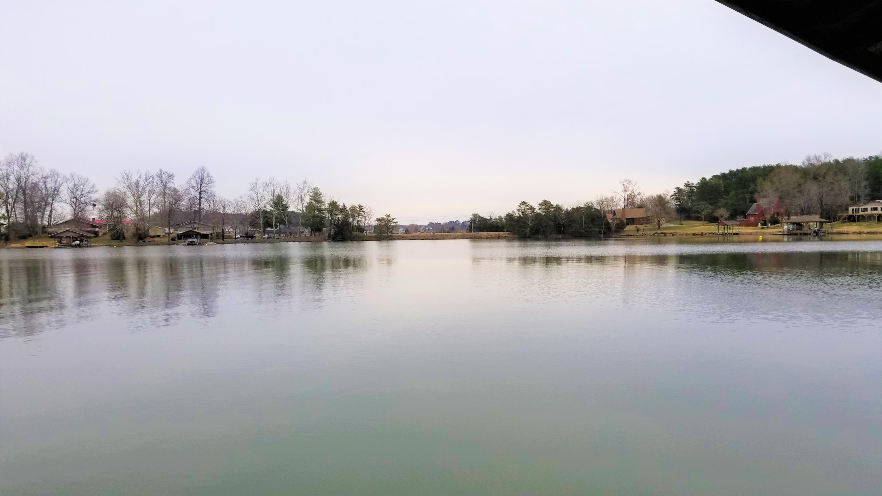 541 Highland Lake Road Union Hall, VA 24176 - Photo 32 of 37 a view of a lake with houses in the back