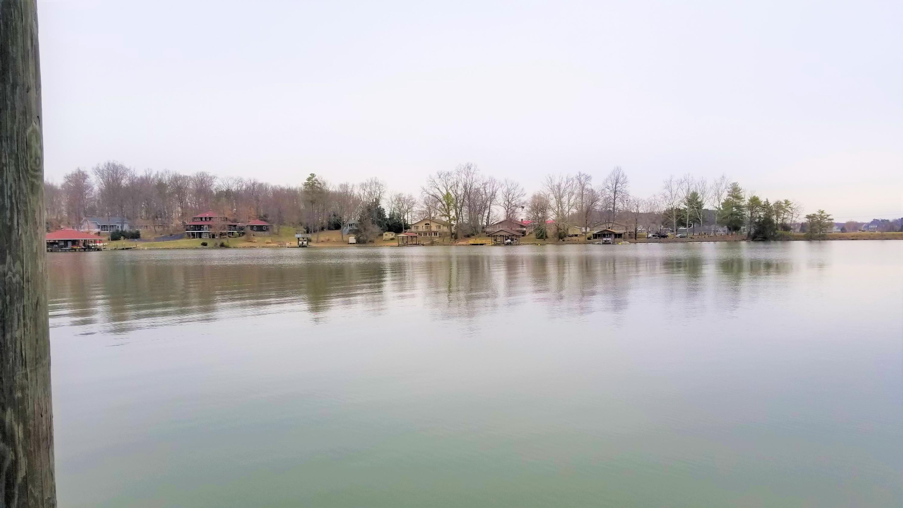 541 Highland Lake Road Union Hall, VA 24176 - Photo 33 of 37 a view of a lake with houses in the back