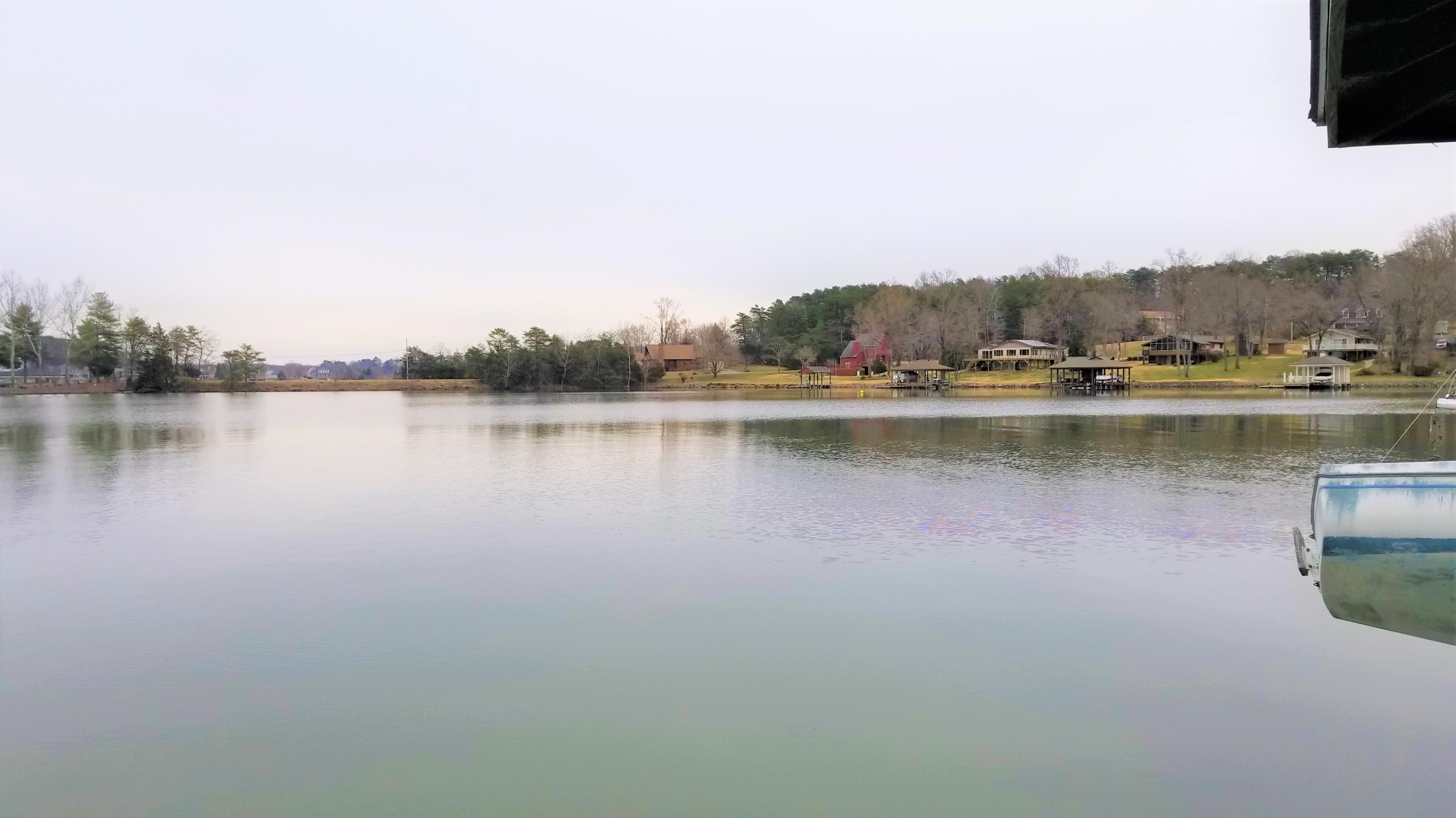541 Highland Lake Road Union Hall, VA 24176 - Photo 34 of 37 a view of a lake with houses in the back