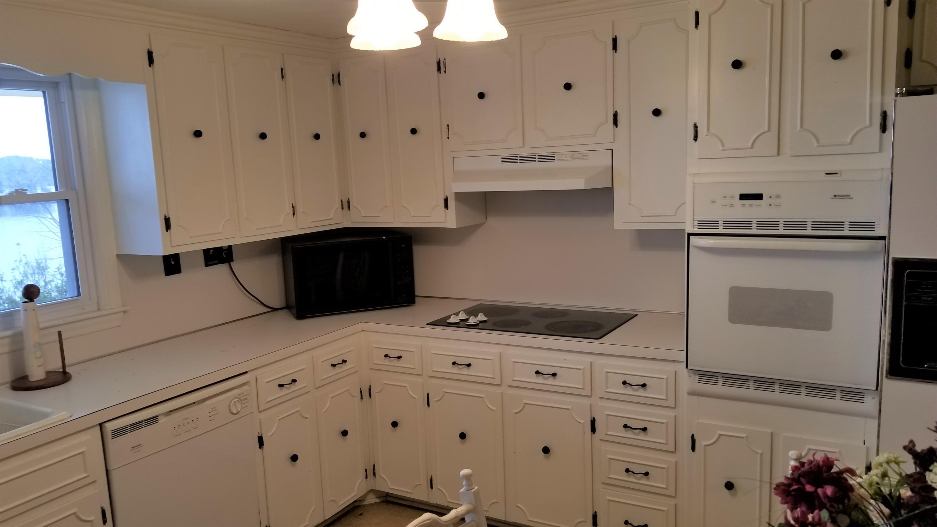 541 Highland Lake Road Union Hall, VA 24176 - Photo 8 of 37 a kitchen with granite countertop white cabinets and sink