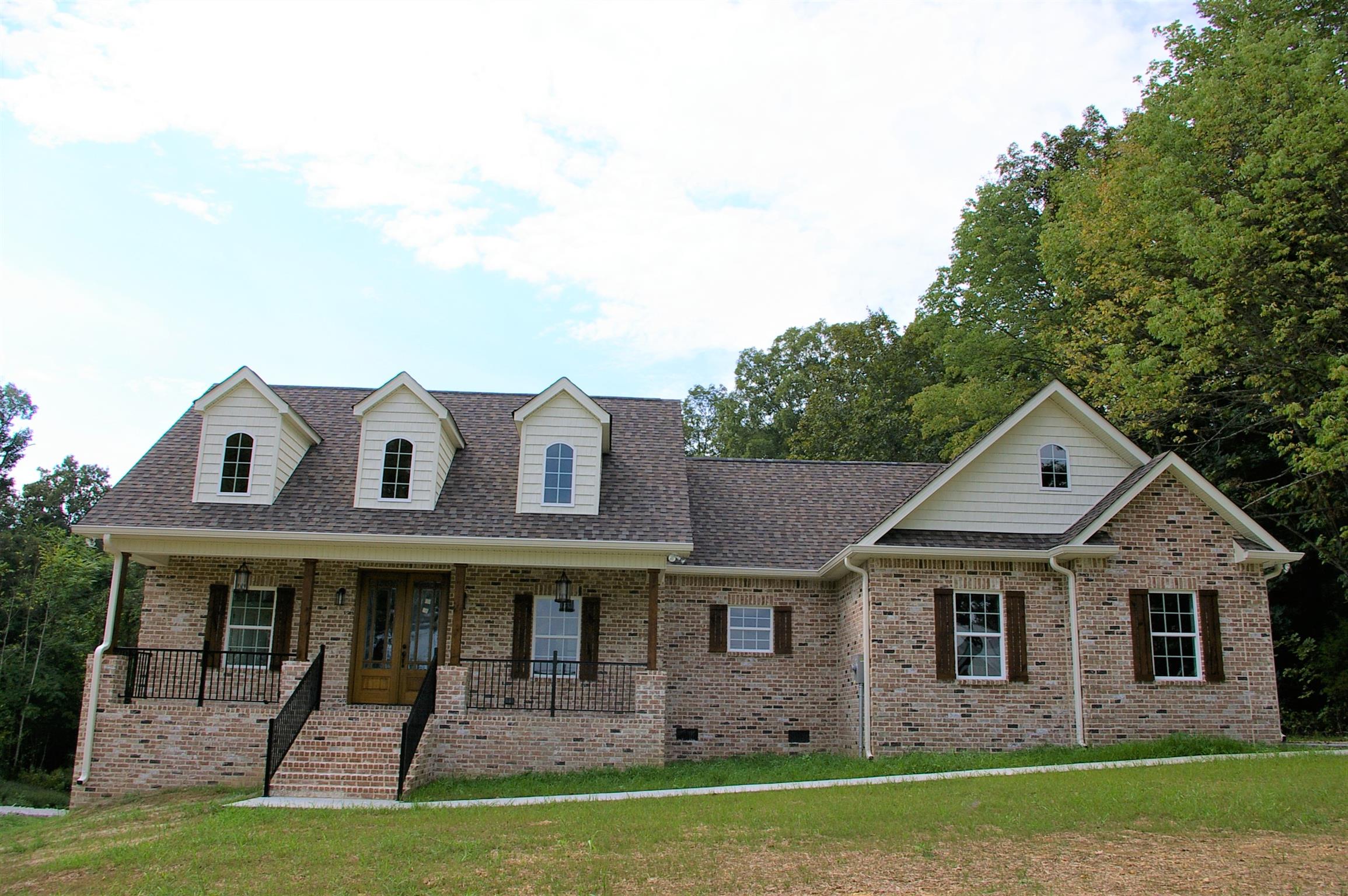 1 Sheltontown Road Manchester, TN 37355 - Photo 1 of 27 a front view of a house with garden