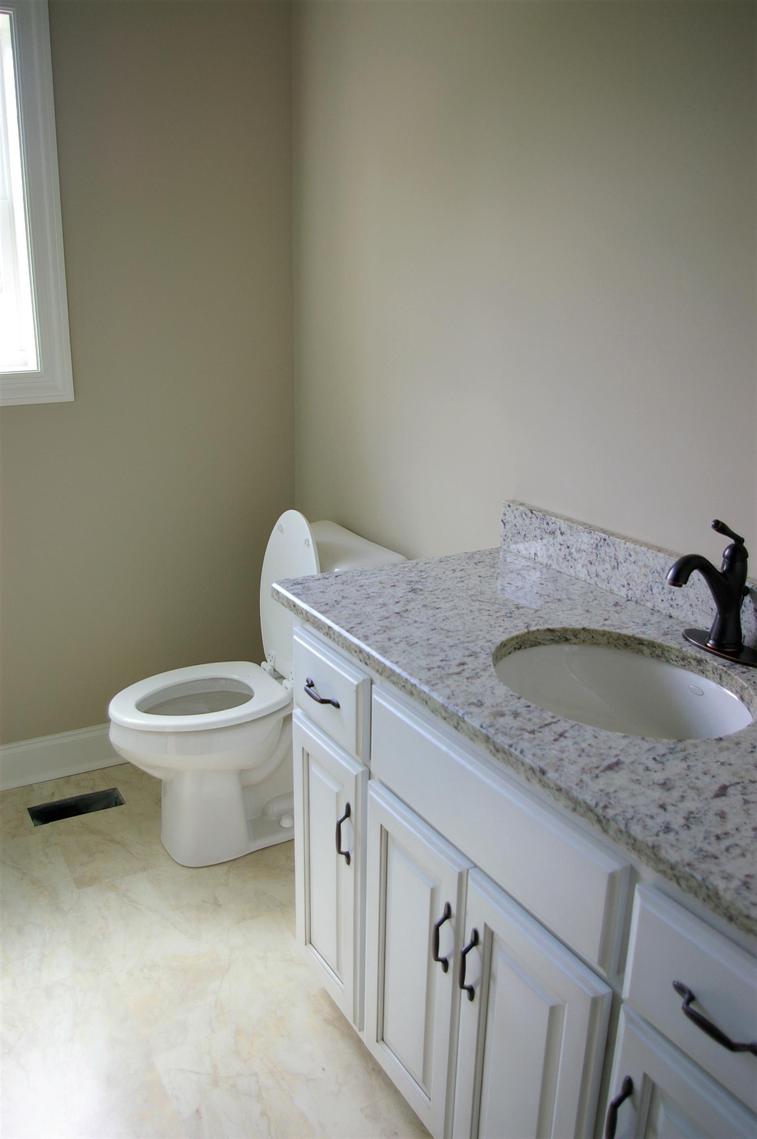 1 Sheltontown Road Manchester, TN 37355 - Photo 21 of 27 a bathroom with a granite countertop toilet and a sink