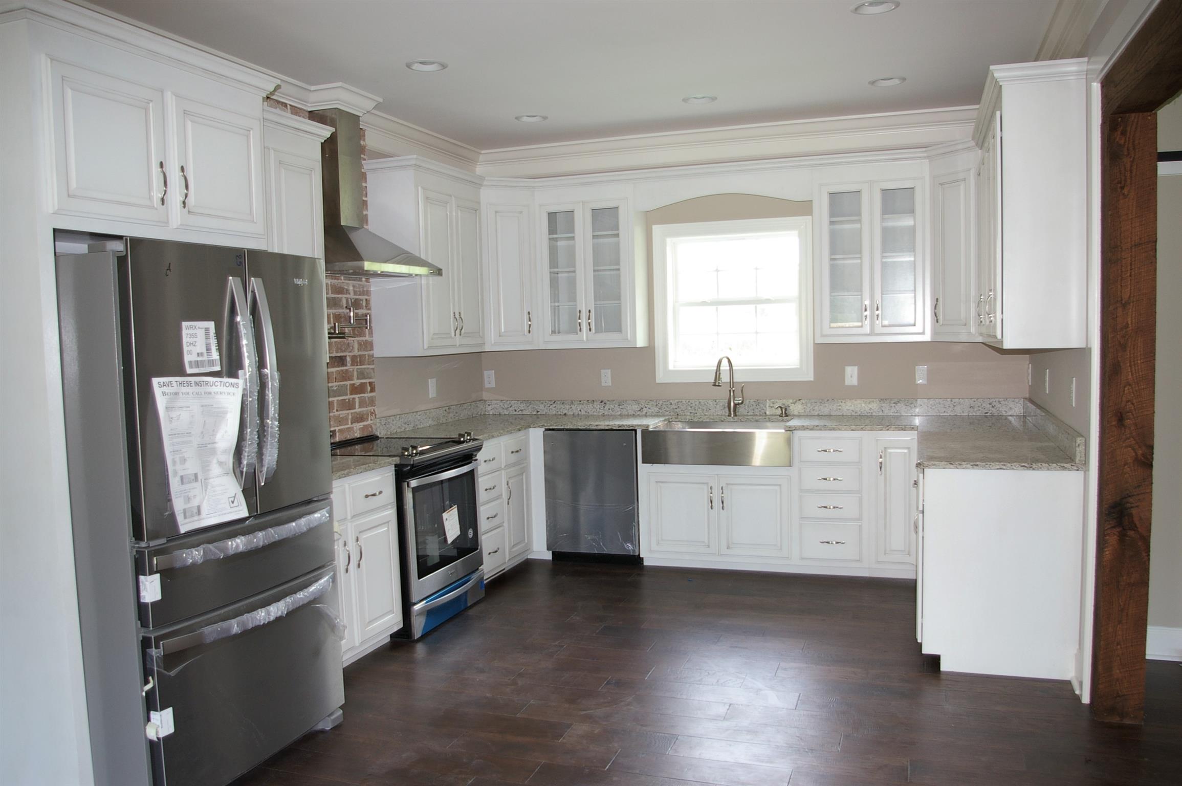 1 Sheltontown Road Manchester, TN 37355 - Photo 3 of 27 a kitchen with granite countertop white cabinets and stainless steel appliances
