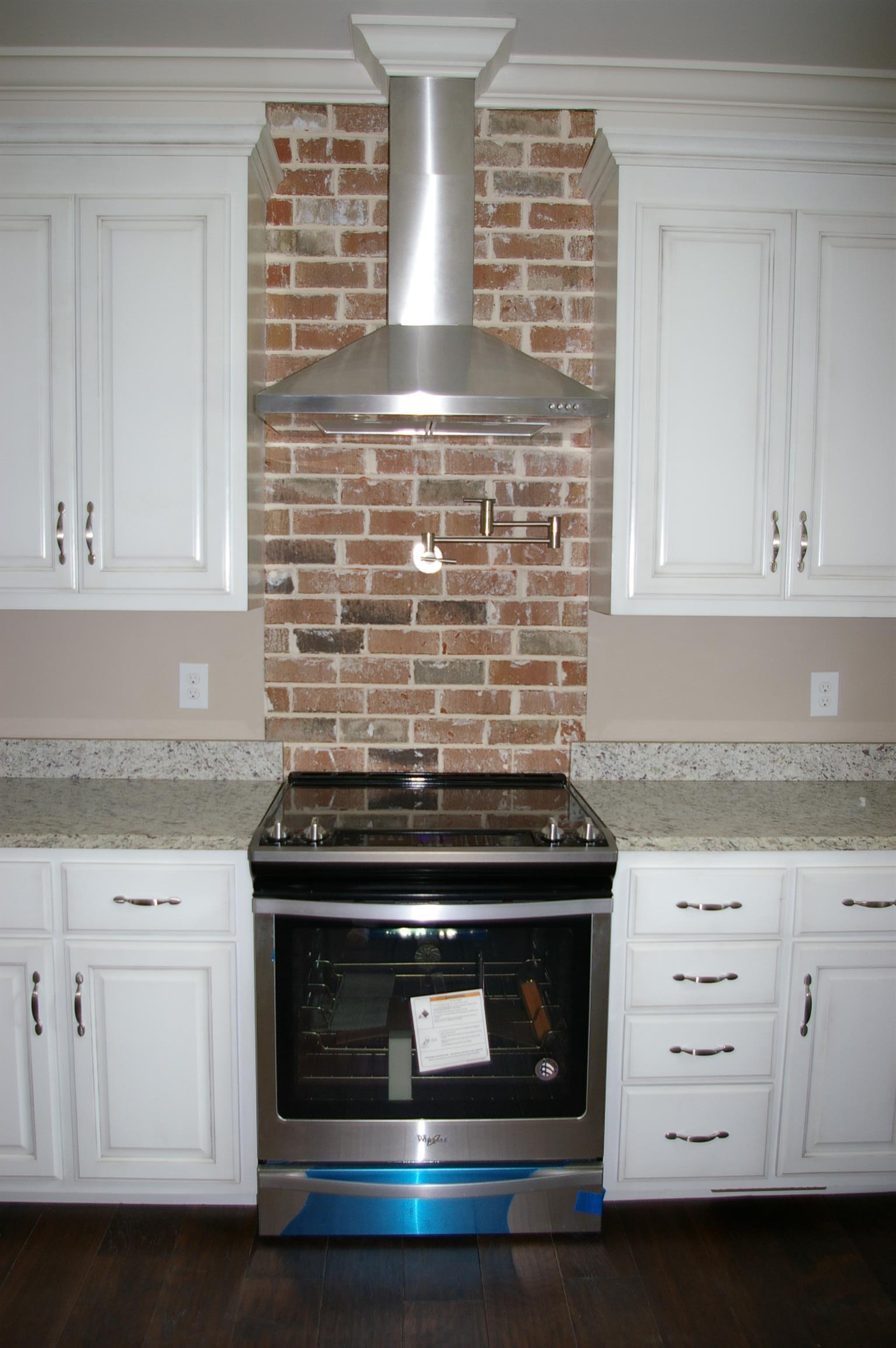 1 Sheltontown Road Manchester, TN 37355 - Photo 4 of 27 a stove top oven sitting inside of a kitchen