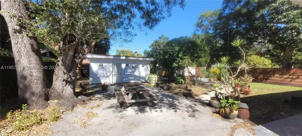 a view of hallway with furniture and a gate