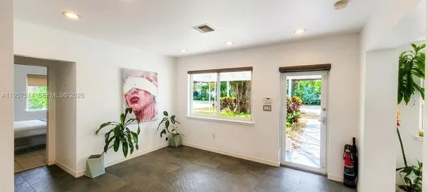 a bathroom with a shower curtain and a sink