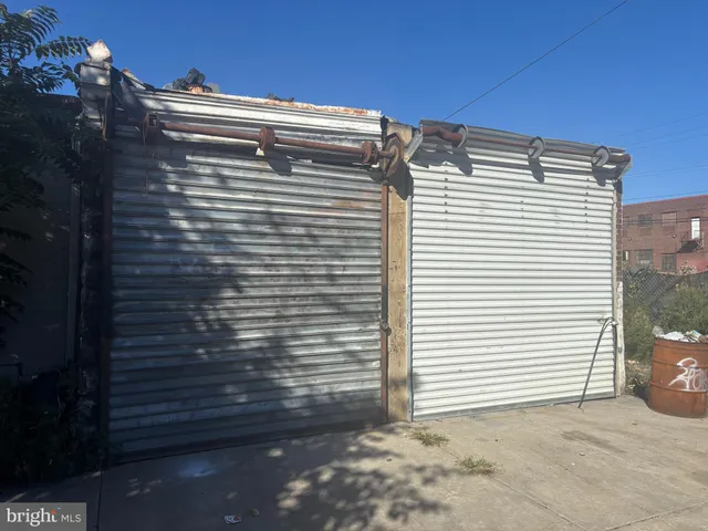 a view of backyard with a small cabin