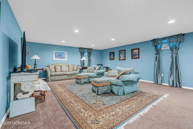 a living room with furniture and a rug
