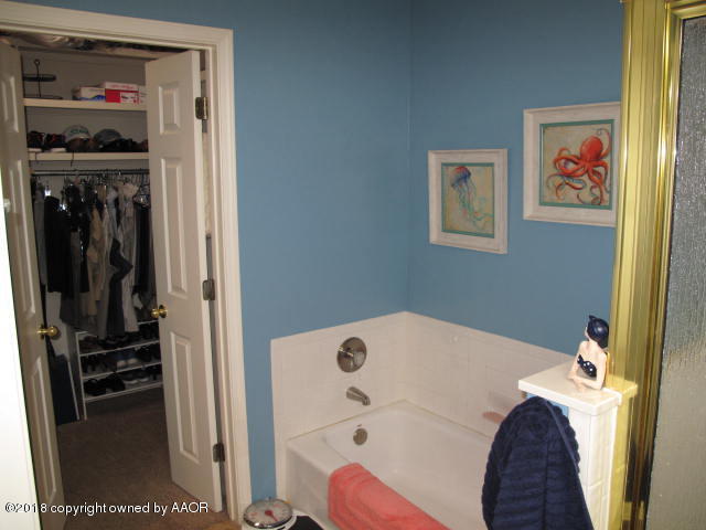 3509 West Point Drive Amarillo, TX 79121 - Photo 17 of 18 a bedroom with a bed and a window