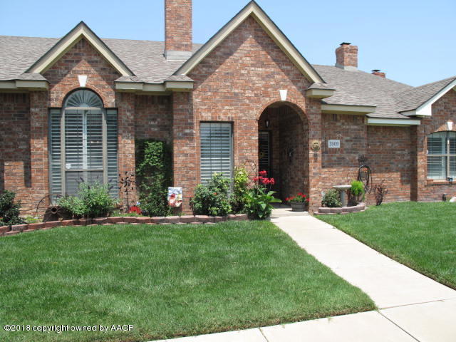 3509 West Point Drive Amarillo, TX 79121 - Photo 2 of 18 a front view of a house with a garden