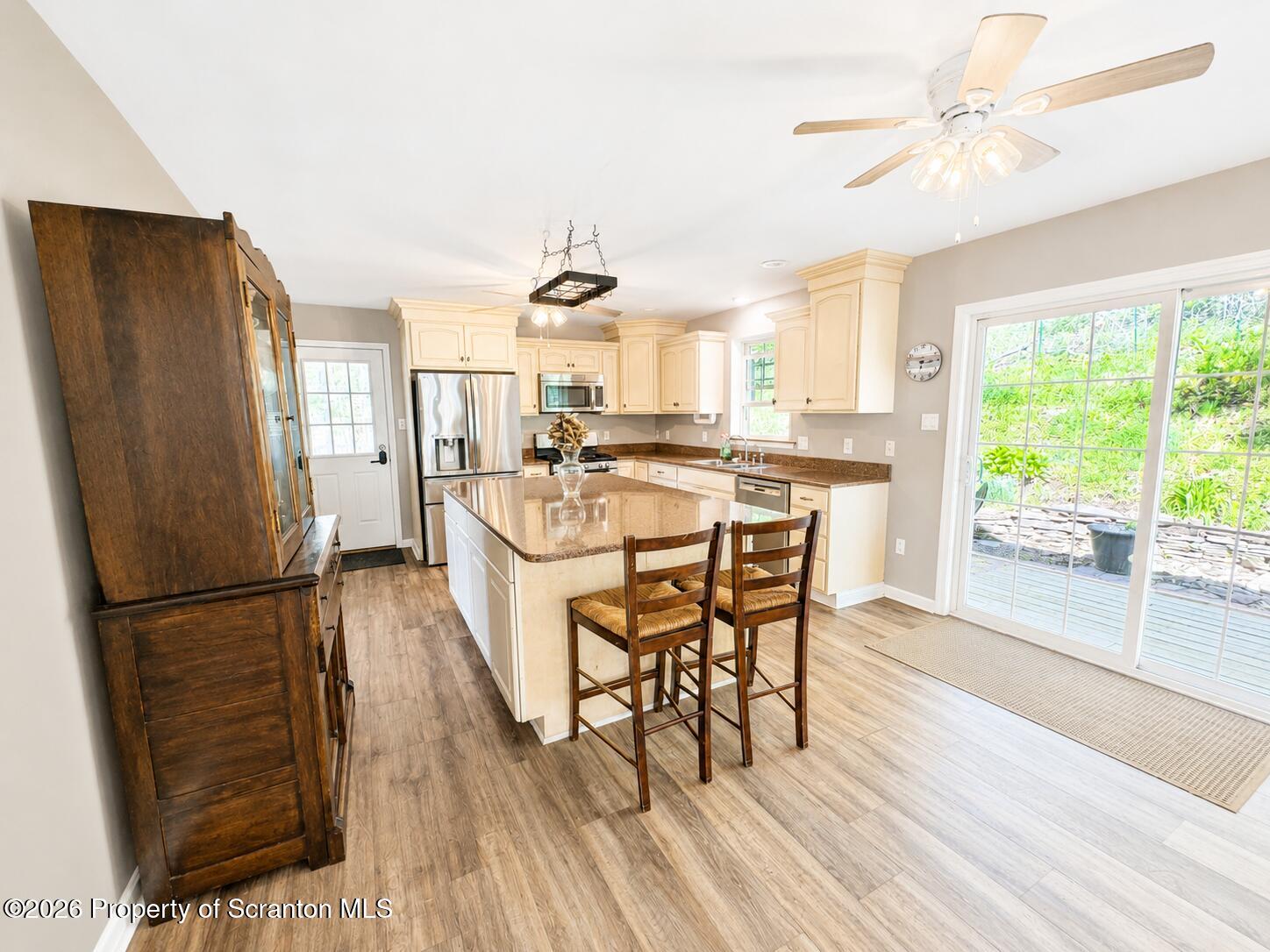 155 Baylor Road Nicholson, PA 18446 - Photo 23 of 53 a kitchen with a table chairs refrigerator and microwave