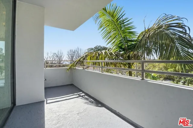 a view of swimming pool from a balcony