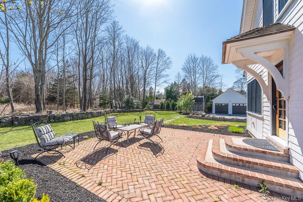 19000 Main Road Mattituck, NY 11952 - Photo 29 of 32 View of patio / terrace with a garage