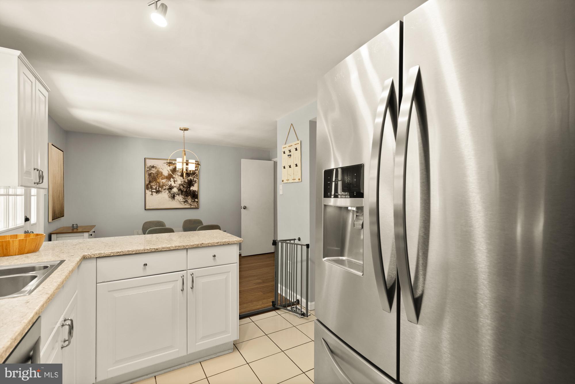 8100 Loving Forest Court Springfield, VA 22153 - Photo 15 of 33 a room with a sink and a refrigerator