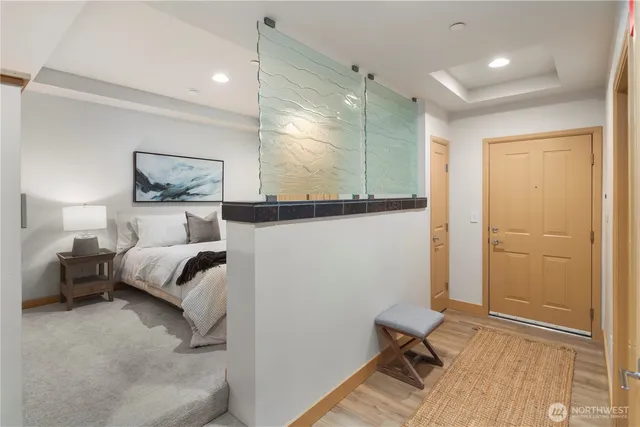 a bedroom with a bed and a table in it