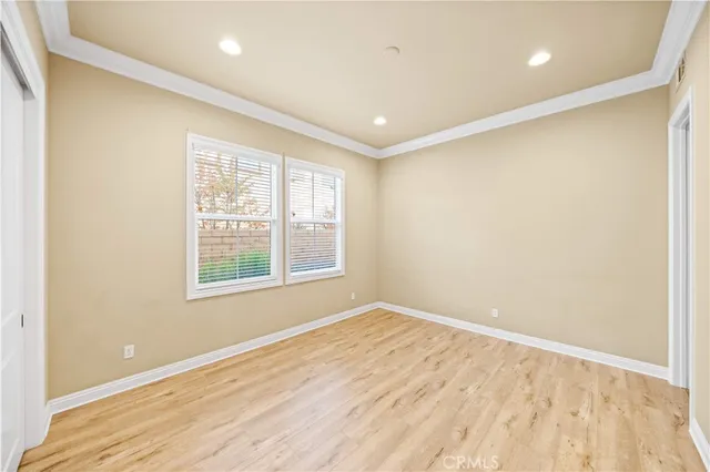 a living room with furniture potted plant and a wooden floor