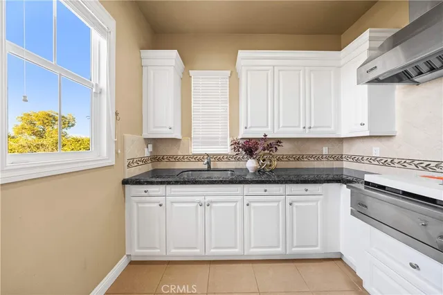 a view of a hallway with wooden floor and entryway
