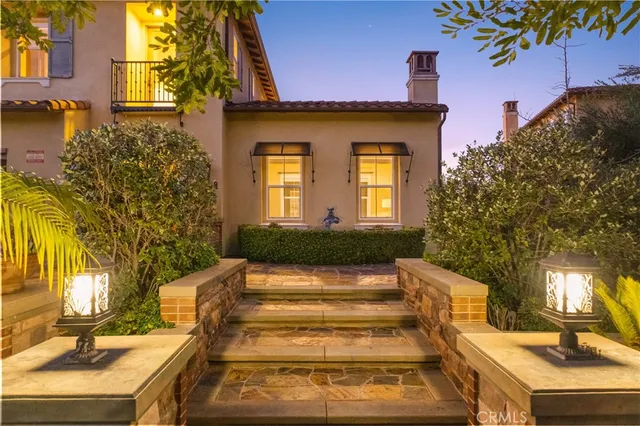 a living room with furniture a large window and a fireplace