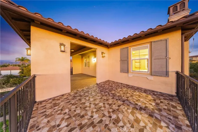 a living room with furniture and large windows