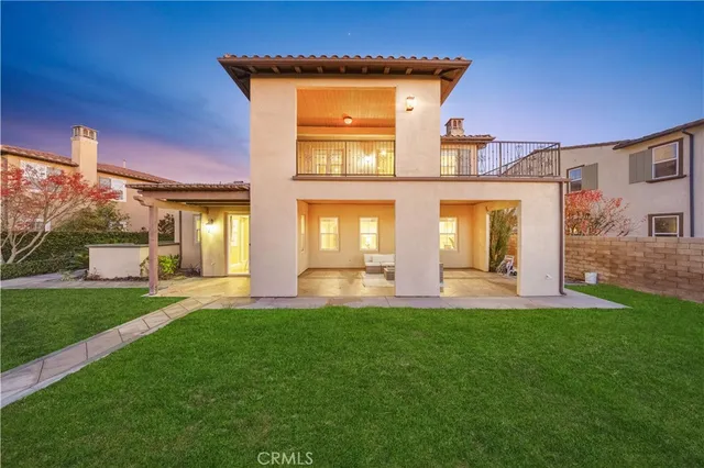 a backyard with grassy field and trees