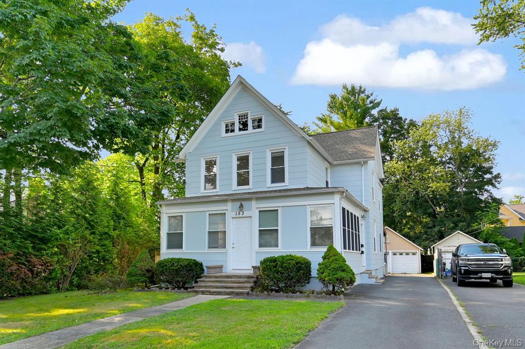 153 Franklin Avenue, Unit 2 Pearl River, NY 10965 - Photo 2 of 25 View of front of home featuring a front lawn, an outbuilding, and a detached garage