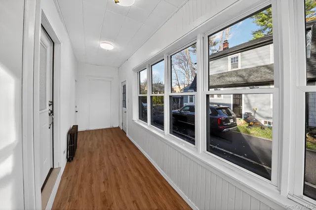 a view of a room with a large window