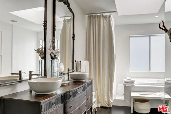 a view of living room with furniture and wooden floor