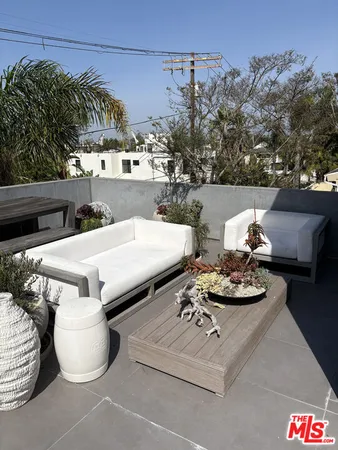 a view of table and chairs in patio
