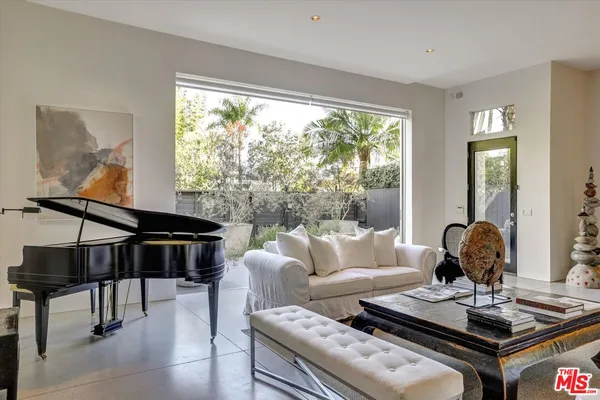 a living room with furniture and a window