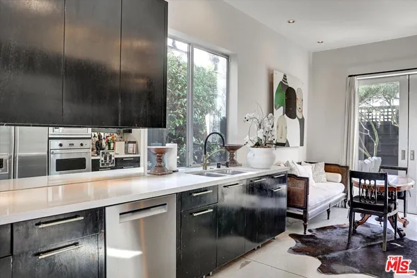 a kitchen with sink cabinets and window