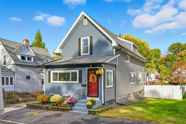 a front view of a house with garden