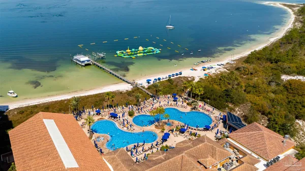 an aerial view of ocean and city