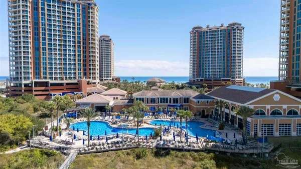 a view of swimming pool with outdoor seating