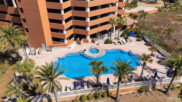 a view of a swimming pool with chairs
