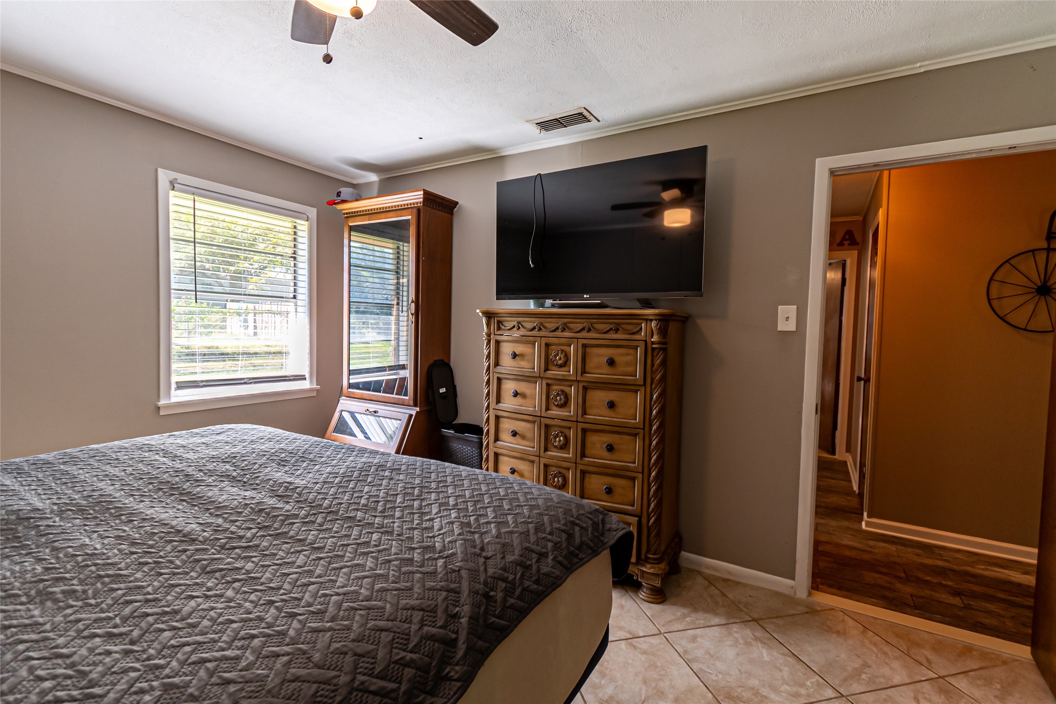 635 East Church Street Centerville, TX 75833 - Photo 15 of 33 a bedroom with a bed and a flat screen tv