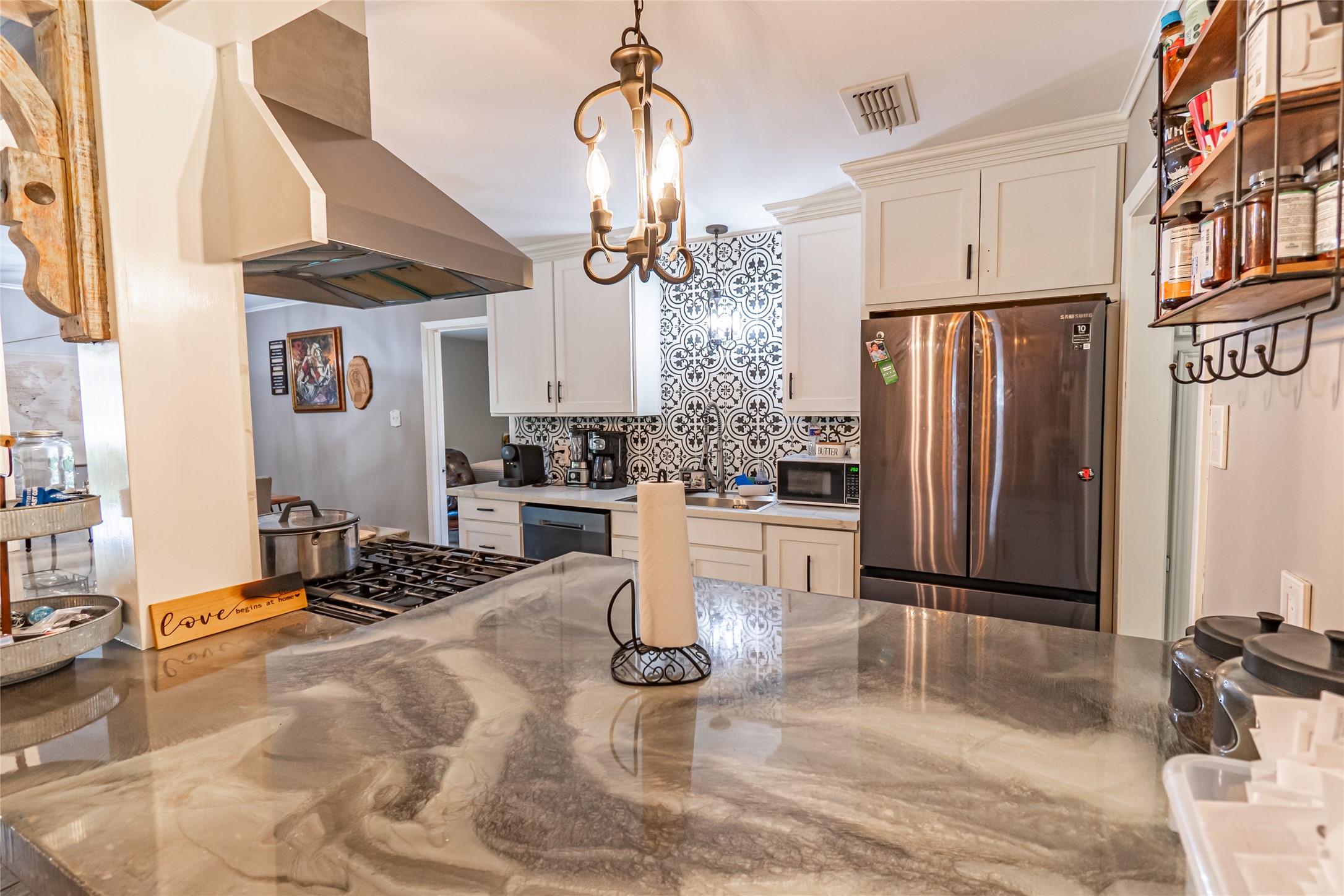 635 East Church Street Centerville, TX 75833 - Photo 2 of 33 a kitchen with stainless steel appliances granite countertop a refrigerator and a stove