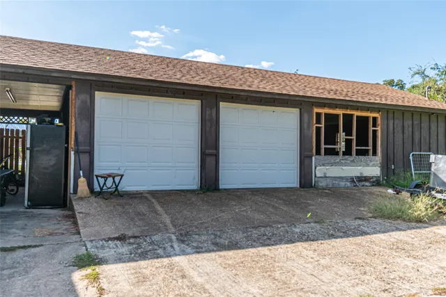 a view of a door and wooden floor