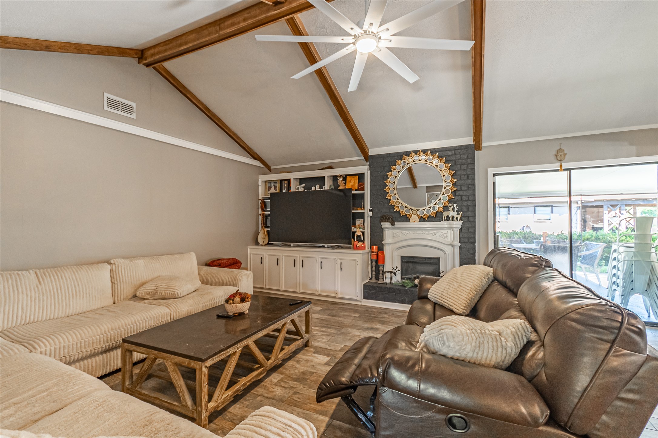 635 East Church Street Centerville, TX 75833 - Photo 33 of 33 a living room with furniture a flat screen tv and a window
