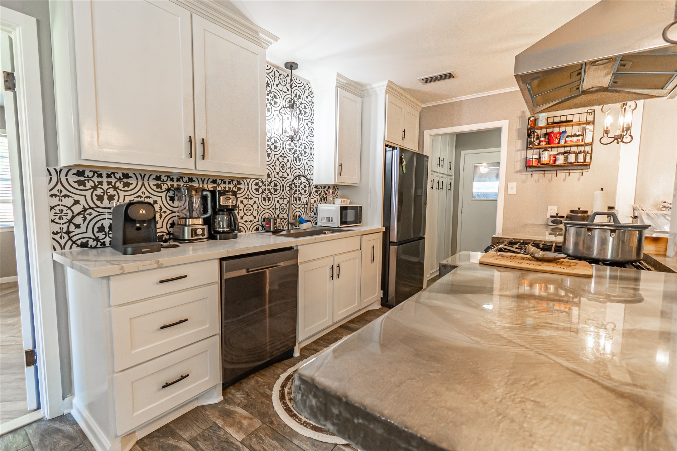 635 East Church Street Centerville, TX 75833 - Photo 7 of 33 a kitchen with white cabinets and white appliances