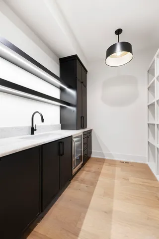 a kitchen with a sink and cabinets