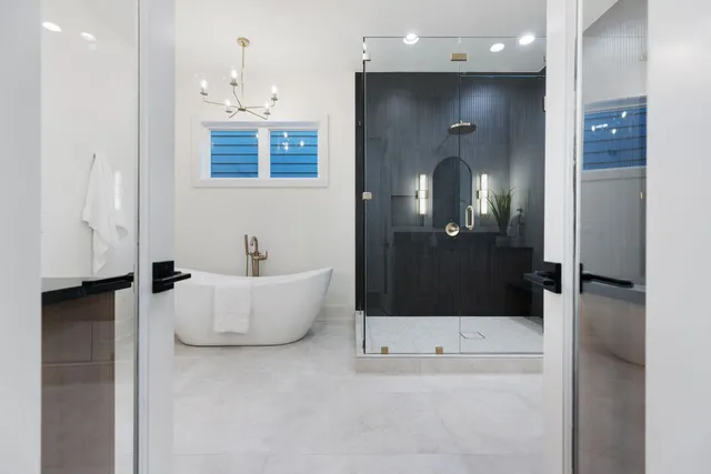 a bathroom with a tub shower and sink