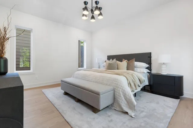 a bedroom with a large bed and a couch