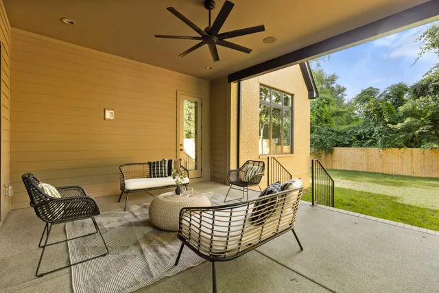 a dining room with furniture and a garden