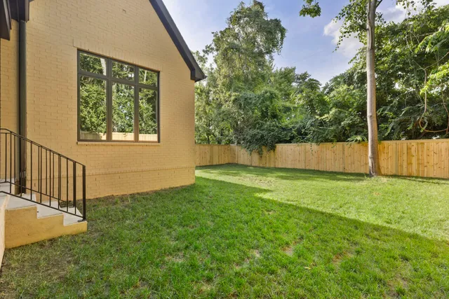 a view of a backyard with a garden and plants